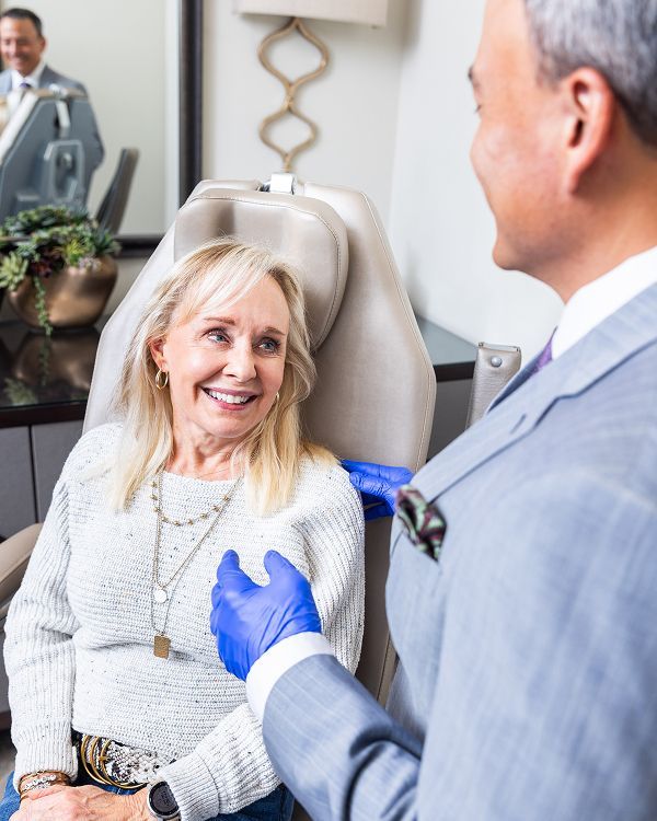 Patient smiling during a consultation with doctor.
