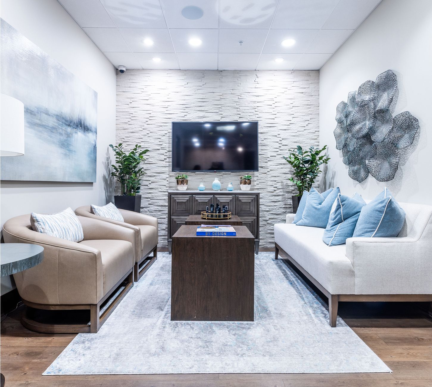 Smiling woman receiving document at a counter.