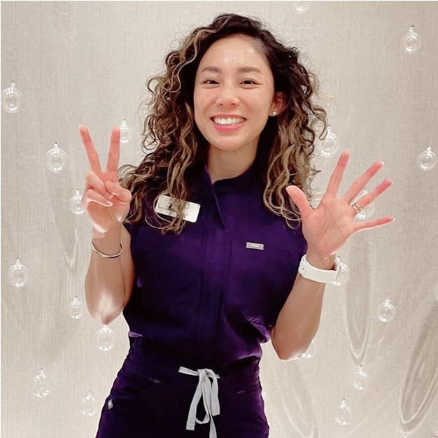 Dentist examining patient in office setting.